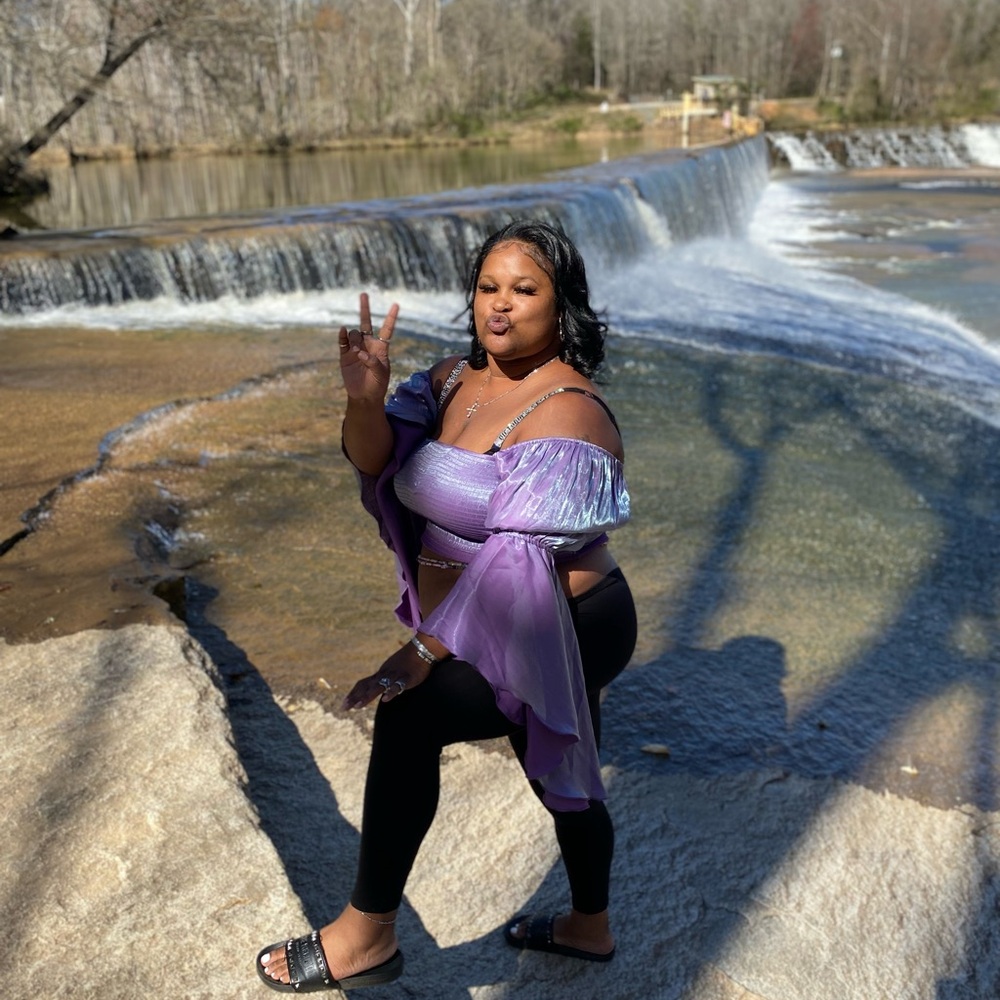 Purple Off-Shoulder Top with Black Leggings